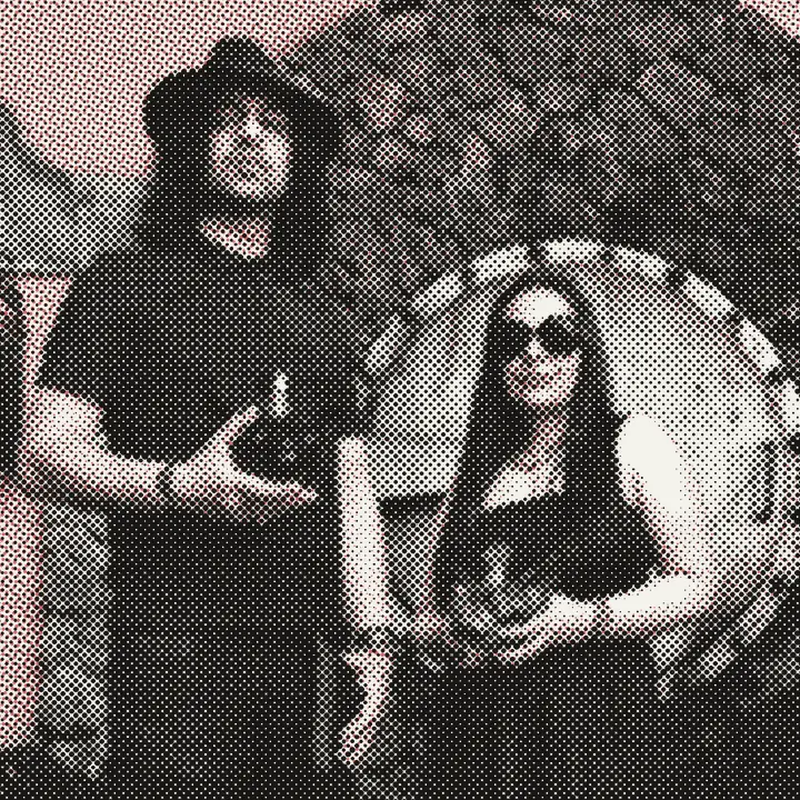 Sukhvinder and Imran Javeed, both in black, each holding a SPHYNX decanter